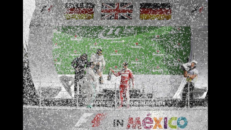 Formula One drivers celebrate on the podium after the Mexican Grand Prix on Sunday, October 30. Lewis Hamilton, top, <a href="index.php?page=&url=http%3A%2F%2Fwww.cnn.com%2F2016%2F10%2F30%2Fmotorsport%2Fmotorsport-mexico-gp-hamilton-rosberg%2Findex.html" target="_blank">won his eighth race of the season.</a>
