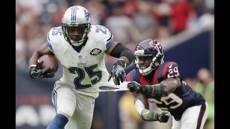 Houston's Andre Hal grabs the jersey of Detroit's Theo Riddick during an NFL game in Houston on Sunday, October 30.