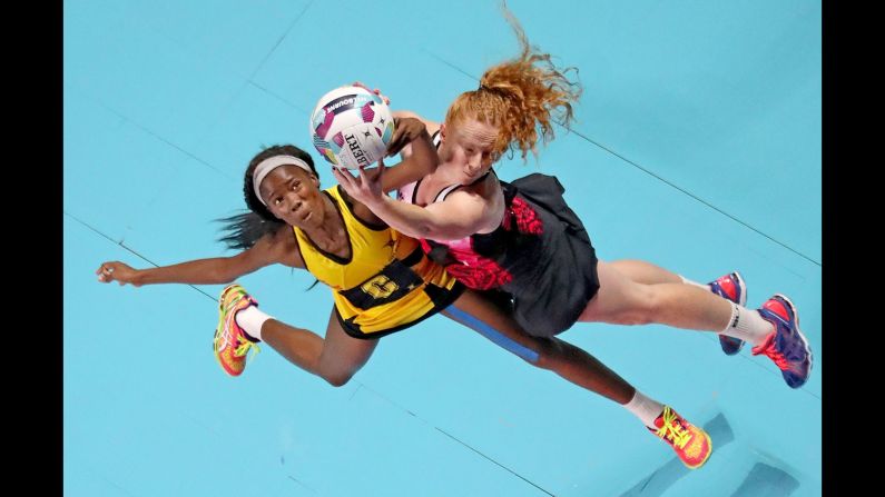 Jamaica's Nicole Dixon, left, and New Zealand's Sam Sinclair compete for the ball during a netball match in Melbourne on Sunday, October 30.