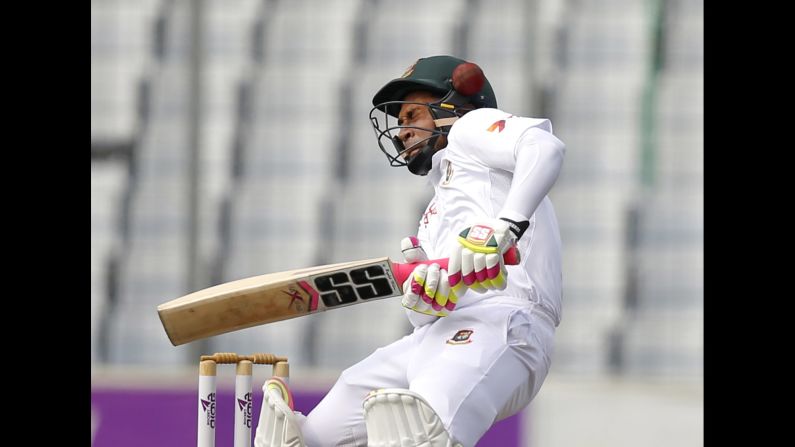 The ball hits the helmet of Bangladesh captain Mushfiqur Rahim as he bats against England in Dhaka, Bangladesh, on Friday, October 28.