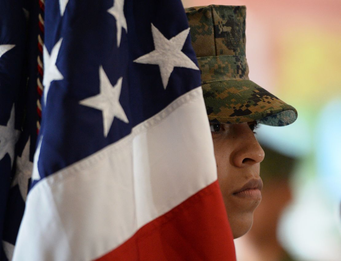A Marine stands next to the US flag during a ceremony at the US Marines headquarters in Manila, the Philippines, in October 2016. 