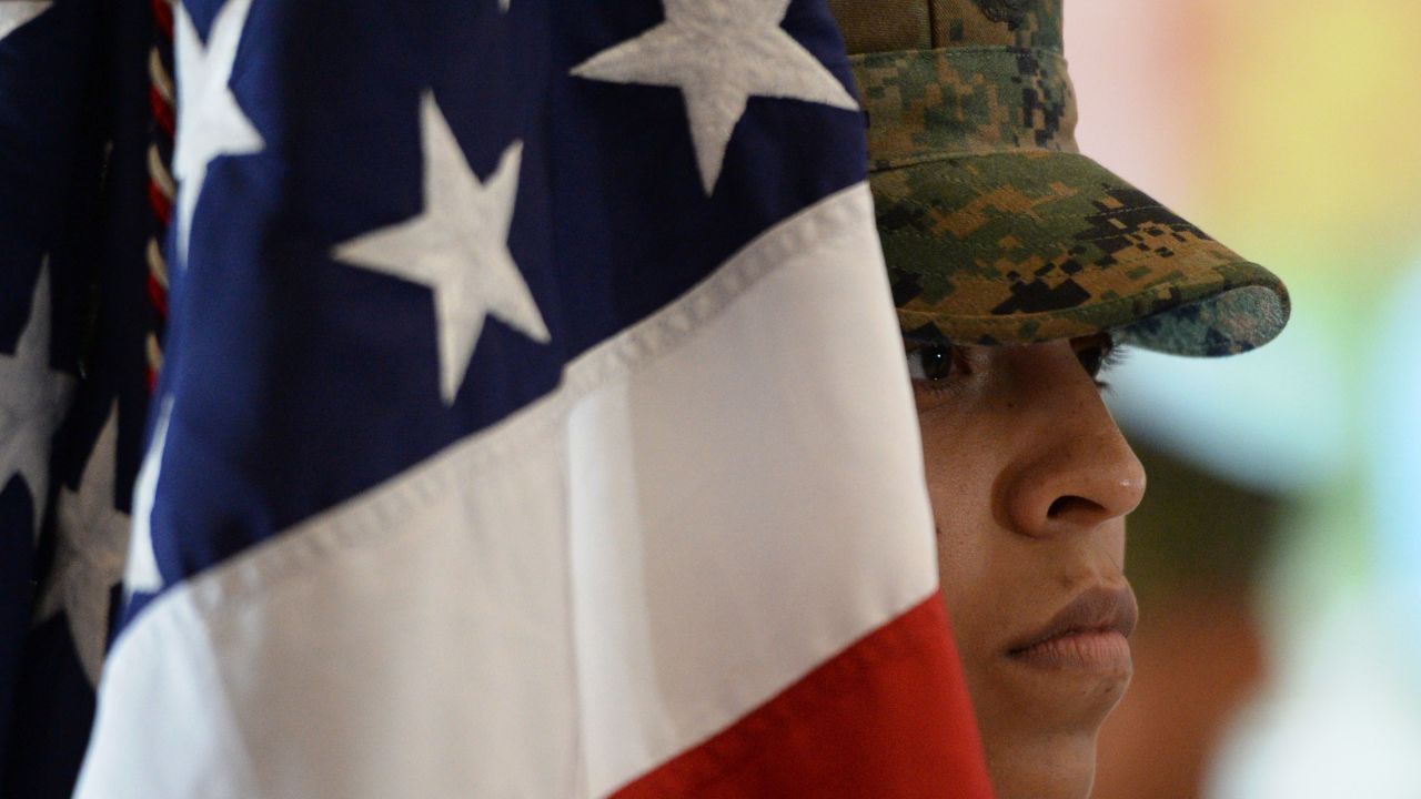 A Marine stands next to the US flag during a ceremony at the US Marines headquarters in Manila, the Philippines, in October 2016.