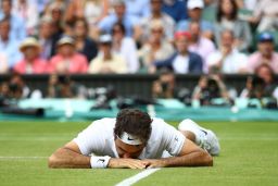 Federer after his fall at Wimbledon