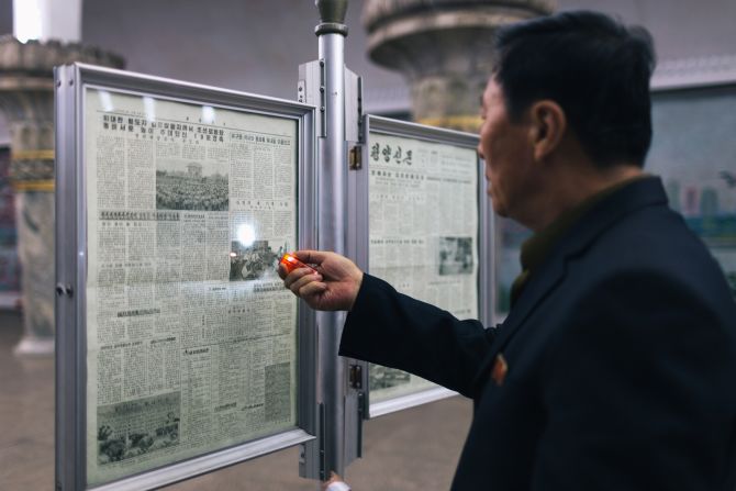  "However, as the platform itself was quite dim, this man brought his portable torch to read the newspaper," Li said. 