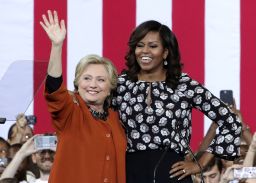 Clinton and Obama greet supporters during a campaign event in Winston-Salem, North Carolina on October 27, 2016 