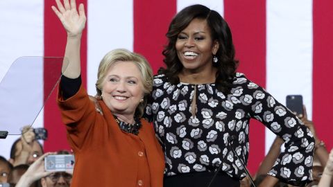 Clinton and Obama greet supporters during a campaign event in Winston-Salem, North Carolina on October 27, 2016