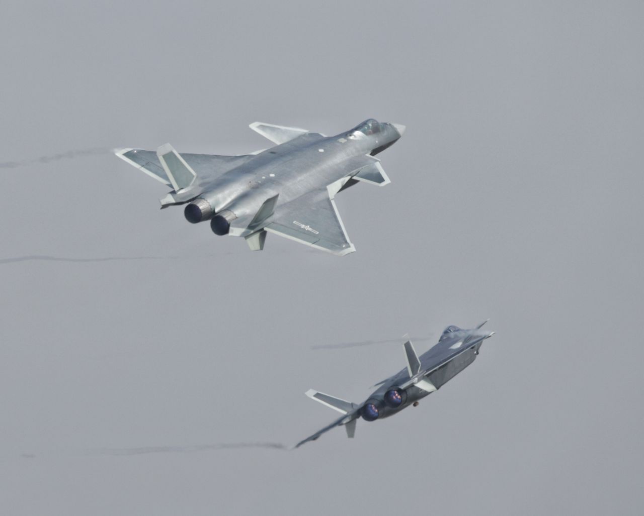 <strong>Chinese J-20 stealth fighters perform during the 11th China International Aviation and Aerospace Exhibition, also known as Airshow China 2016, in Zhuhai on November 1, 2016. The J-20 is one of China's answers to US F-22 and F-35 stealth fighters.</strong>