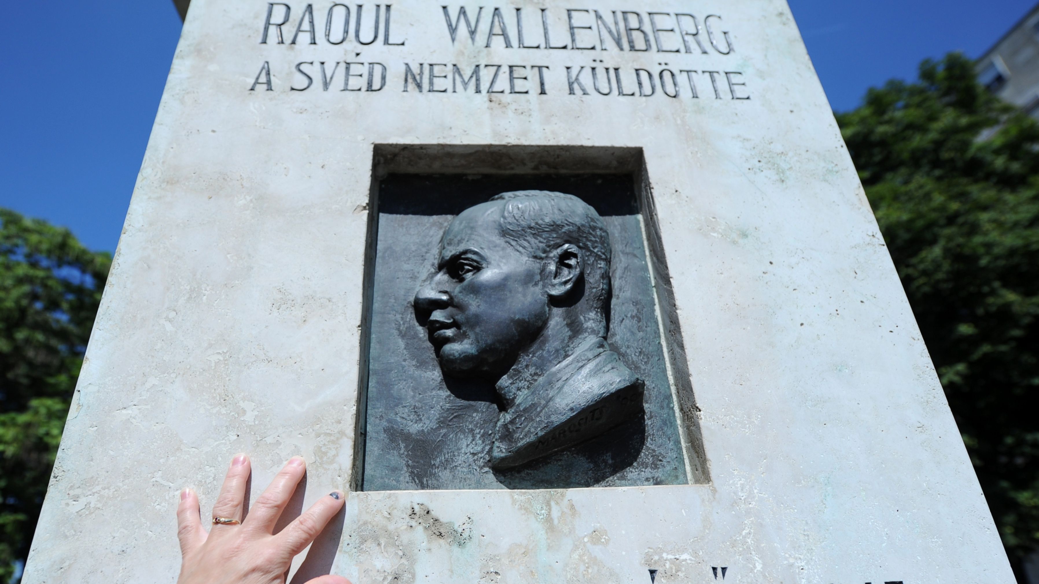 Wallenberg has been honored for his wartime efforts around the globe. He was awarded the US Congressional Gold medal in 2012. Pictured, a woman touches his memorial in Budapest.