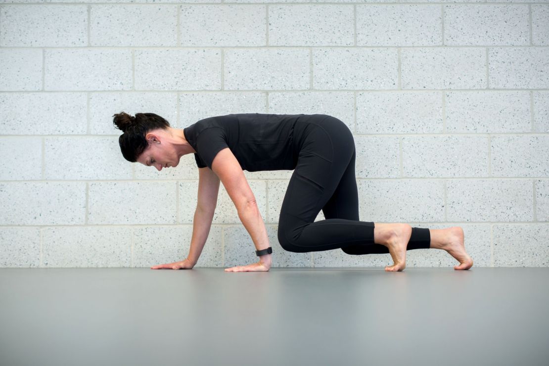 Danielle Johnson demonstrates how to crawl for exercise.