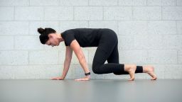 Danielle Johnson, a physical therapist at the Mayo Clinic Healthy Living Program, demonstrates how to crawl for exercise