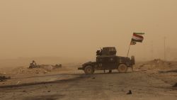 MOSUL, IRAQ - NOVEMBER 01: A view of Mosul-Erbil Highway, secured by Iraqi army members, during a sandstorm near Tehrawa village between Bertilla and Kokceli, as the operation to retake Iraq's Mosul from Daesh terrorists continues in Mosul, Iraq on November 1, 2016.  (Photo by Hemn Baban/Anadolu Agency/Getty Images)