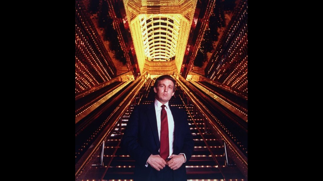 Trump stands in the atrium of the Trump Tower. 