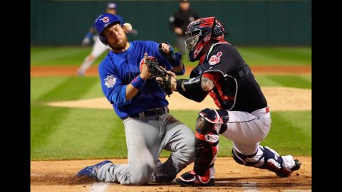 Ben Zobrist of the Cubs collides with the Indians' Roberto Perez in the first inning of Game 6.