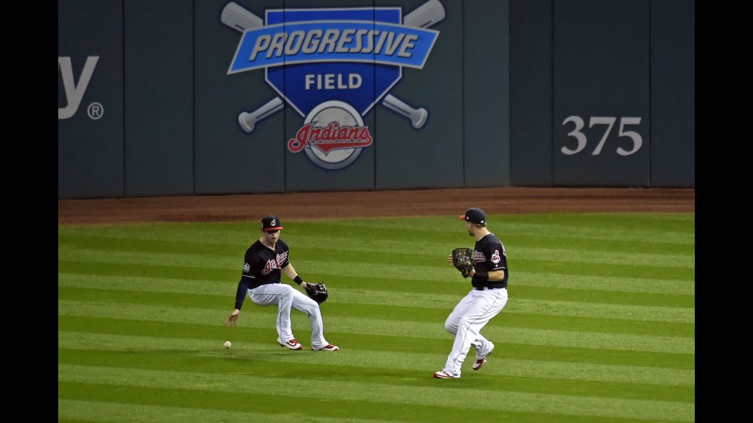 Tyler Naquin and Lonnie Chisenhall of the Indians are unable to make a play in the first inning of Game 6.