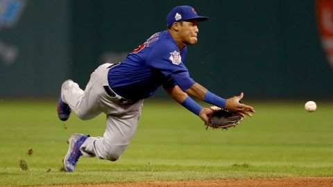 Addison Russell of the Cubs tosses the ball to Javier Baez (not pictured) for a force out in the sixth inning of Game 6.