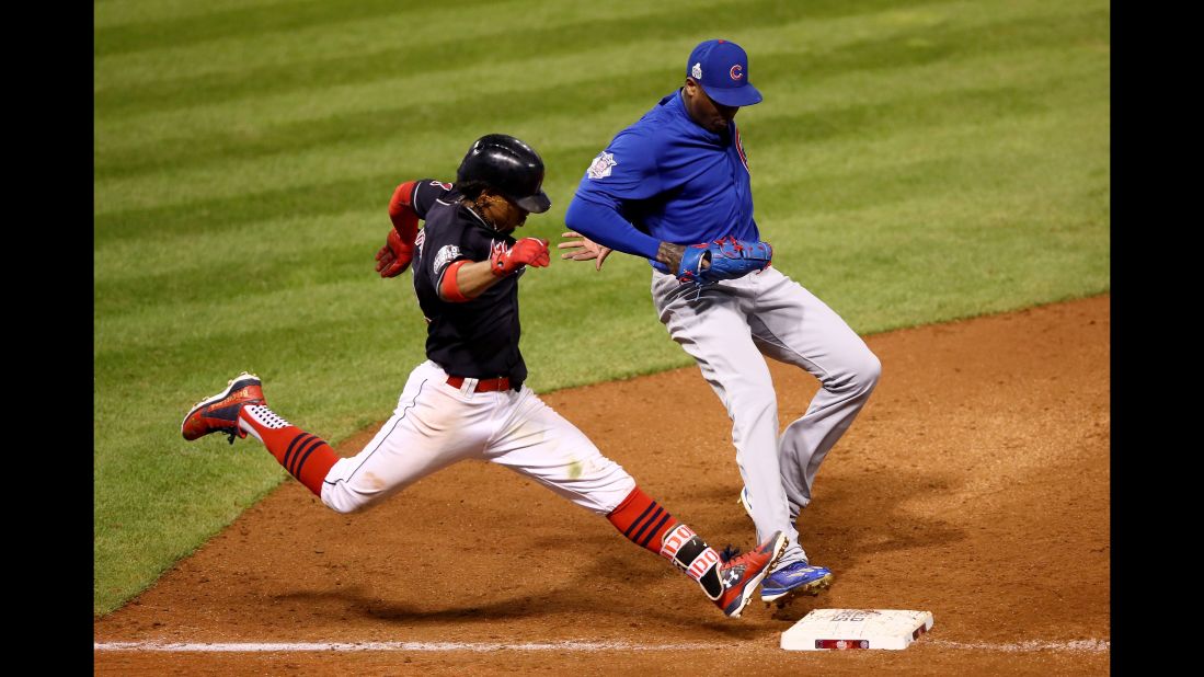 Aroldis Chapman of the Cubs races Francisco Lindor of the Indians to the bag during the seventh inning in Game 6.