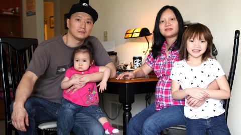 Korean adoptee Adam Crapser, left, with daughters, Christal and Christina and his wife, Anh Nguyen, in their Vancouver, Washington home. 