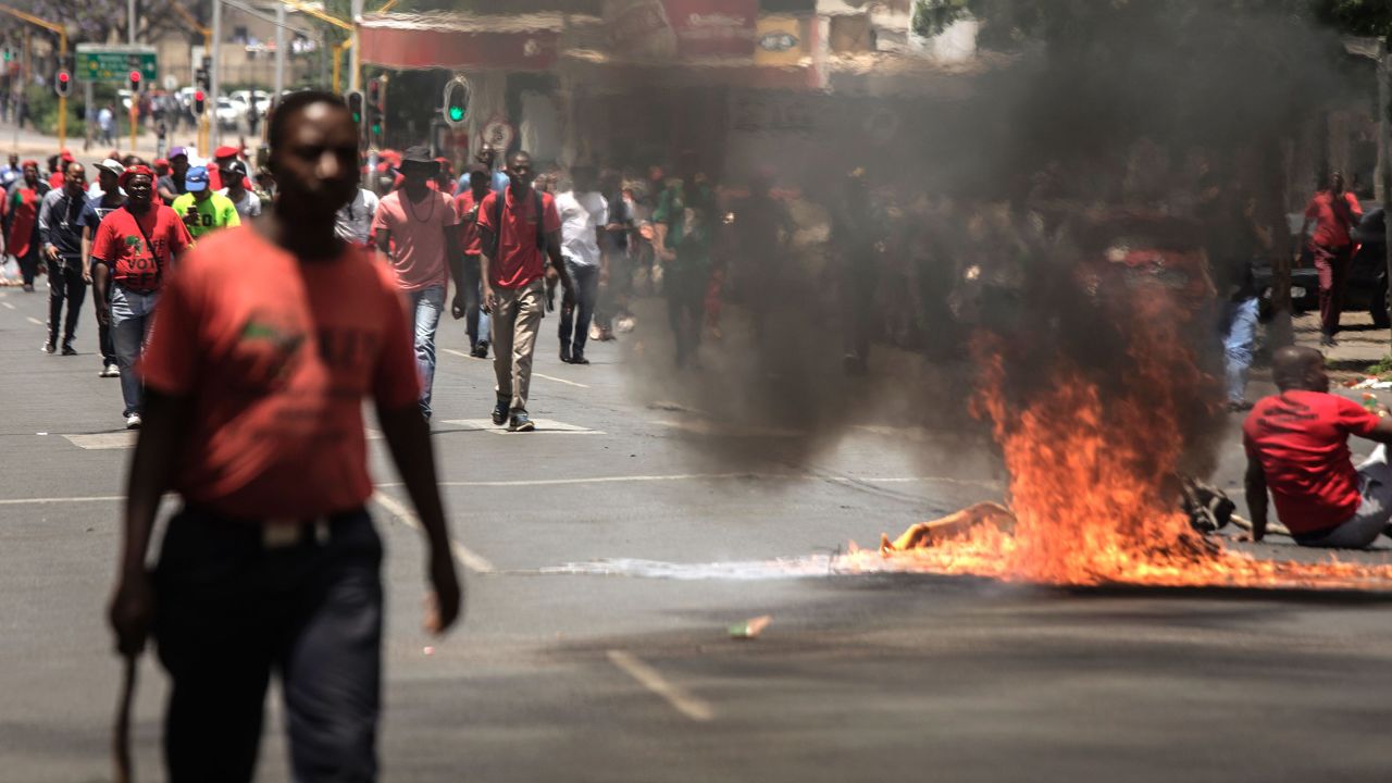 Garbage burns in the road during a demonstration Wednesday in Pretoria, South Africa.