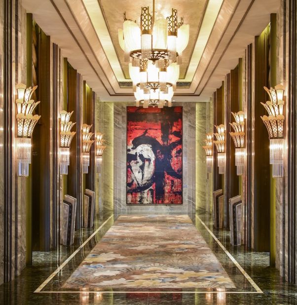 Magnolia motifs and textured Art Deco details run throughout the hotel, including the elevator halls. On the ground floor, an elaborate oil painting by artist Huang Gang is anchored to the wall. <br />