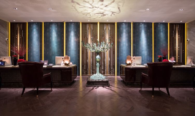 The Wanda Hotels & Resorts group specially commissioned art pieces for the hotel, as well as intricate Suzhou-style embroideries. In the reception area, walls paved with manta ray leather dyed a rich blue surround "Fantasy Wonderland," a bronze sculpture by Wei Dong.