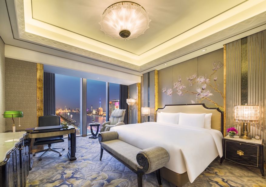The hotel has 193 guestrooms, including 14 suites. A Grand Deluxe Bund View Bedroom comes with an Ogawa massage chair, Hermès toiletries, an open marble bathroom, heated bathroom floors and an automatic Japanese toilet. Plus plenty of lavish retro-style décor. 