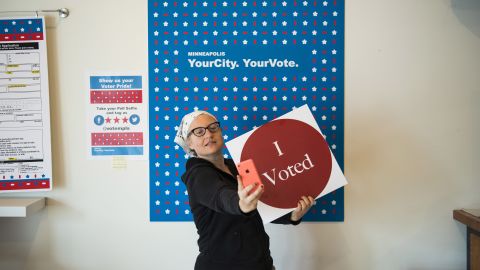 MINNEAPOLIS, MN - SEPTEMBER 23: Minneapolis resident Robin Marty takes a selfie with an "I Voted" sign after voting early at the Northeast Early Voting Center on September 23, 2016 in Minneapolis, Minnesota. Minnesota residents can vote in the general election every day until Election Day on November 8. (Photo by Stephen Maturen/Getty Images)