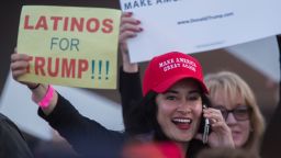 A woman hoods a sign expressing Latino support for Republican presidential candidate Donald Trump at his campaign rally at the Orange County Fair and Event Center, April 28, 2016, in Costa Mesa, California.
Trump is vying for votes in the June 7 California primary election in hope of narrowing the gap to the 1,237 delegates needed to win the Republican presidential nomination. 