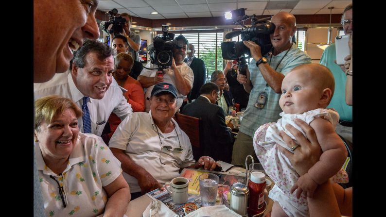 A baby looks at Maryland Gov. Larry Hogan at a diner in Annapolis, Maryland, on July 15, 2015. Hogan was there to endorse Republican presidential candidate Chris Christie, at left in the blue tie. Christie <a href="index.php?page=&url=http%3A%2F%2Fwww.cnn.com%2F2015%2F06%2F30%2Fpolitics%2Fchris-christie-2016-presidential-campaign%2F" target="_blank">joined the race</a> with strong national name recognition and a record in public office that spans more than a decade, having served as New Jersey's governor since 2010 and a U.S. Attorney from 2002-2010.
