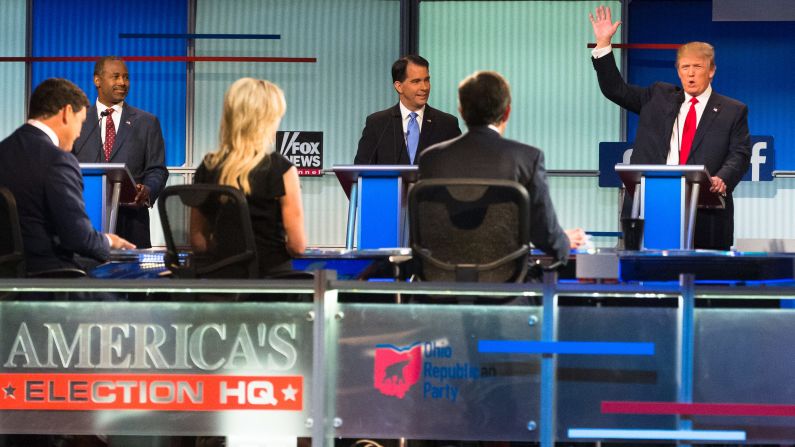 Trump raises his hand during <a href="index.php?page=&url=http%3A%2F%2Fwww.cnn.com%2F2015%2F08%2F07%2Fpolitics%2Fgallery%2Frepublican-debate-2-gop-presidential-2016%2Findex.html" target="_blank">the first Republican debates</a> of the campaign, which took place in Cleveland on August 6, 2015. Trump kicked off the event by refusing to rule out a third-party run and pledge his support to whoever becomes the Republican nominee. He was joined on stage by nine other candidates -- seven of the lower-polling candidates <a href="index.php?page=&url=http%3A%2F%2Fwww.cnn.com%2F2015%2F08%2F06%2Fpolitics%2Fgallery%2Frepublican-debate-1-gop-presidential-2016%2Findex.html" target="_blank">had a separate debate</a> before the main event.