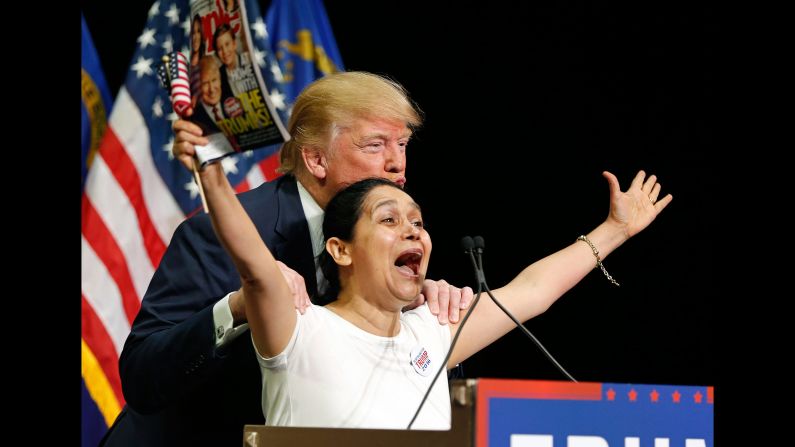 Trump poses with a woman he brought up on stage during a rally in Las Vegas on October 8, 2015. The woman <a href="index.php?page=&url=http%3A%2F%2Fwww.cnn.com%2F2015%2F10%2F08%2Fpolitics%2Flatino-woman-las-vegas-trump-adoring-fan%2F" target="_blank">kissed Trump</a> as she clutched a copy of his People magazine cover. "I'm Hispanic and I vote for Mr. Trump! She said. "We vote for Mr. Trump! Yes! Mr. Trump! We love you! We love you, all the way to the White House!" Trump, who had come under fire for his comments about Hispanics, seemed to understand how it might be perceived. "I swear to you -- I think she's totally beautiful and great -- I've never met her before, I swear," he said.