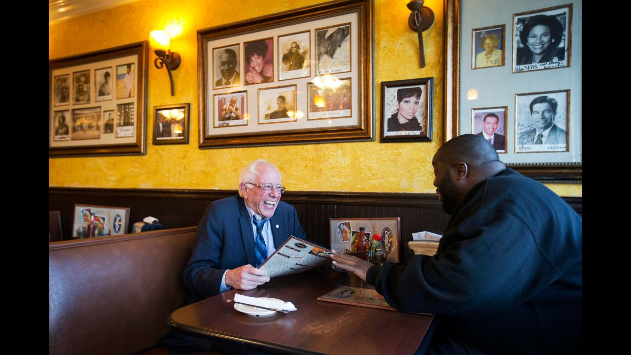 Sanders sits in an Atlanta cafe with rapper Killer Mike on November 23, 2015. The rapper introduced Sanders at a campaign event later that day.