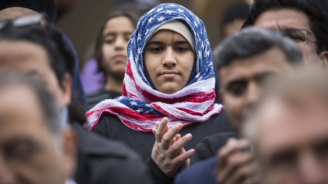 Hidayah Martinez Jaka wears an American flag hijab as Democratic presidential candidate Martin O'Malley speaks at a mosque in Sterling, Virginia, on December 11, 2015.