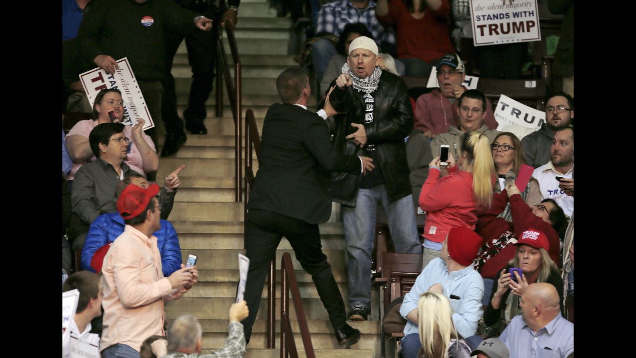 A protester is removed by security personnel during a Trump campaign event in Rock Hill, South Carolina, on January 8, 2016.