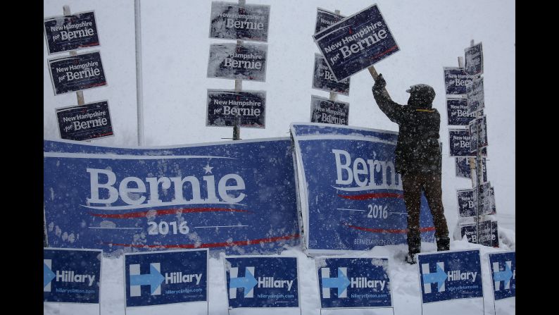 A campaign worker brushes snow off Sanders signs in Manchester, New Hampshire, on February 5, 2016. Sanders <a href="index.php?page=&url=http%3A%2F%2Fwww.cnn.com%2F2016%2F02%2F09%2Fpolitics%2Fnew-hampshire-primary-highlights%2F" target="_blank">won the New Hampshire primary</a> a few days later.