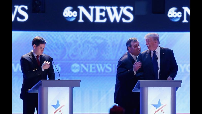 Trump and Christie talk to each other during a commercial break at the Republican debate in Manchester, New Hampshire, on February 6, 2016. At left is U.S. Sen. Marco Rubio. Trump <a href="index.php?page=&url=http%3A%2F%2Fwww.cnn.com%2F2016%2F02%2F09%2Fpolitics%2Fnew-hampshire-primary-highlights%2F" target="_blank">won the New Hampshire primary</a> on February 9 -- his first victory on the way to the nomination.