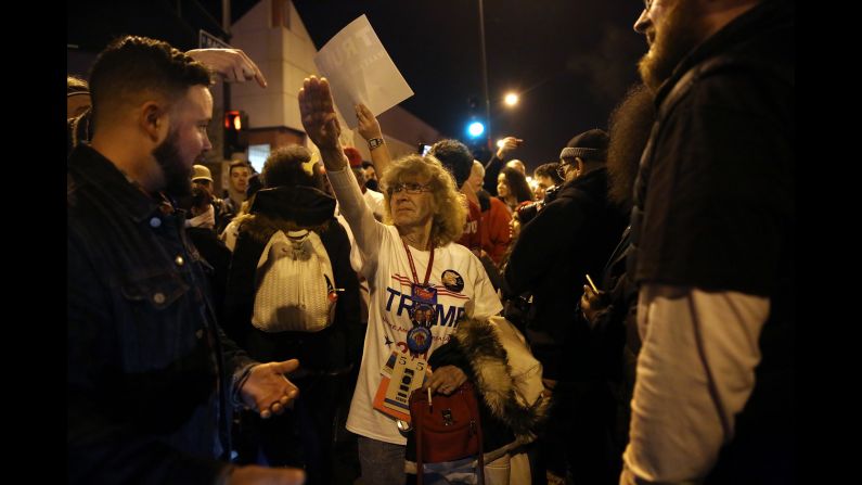 Trump supporter Birgitt Peterson argues with protesters outside a canceled Trump rally in Chicago on March 11, 2016. Peterson <a href="index.php?page=&url=http%3A%2F%2Fwww.chicagotribune.com%2Fnews%2Fct-birgitt-peterson-trump-rally-met-0313-20160312-story.html" target="_blank" target="_blank">told the Chicago Tribune</a> that she responded with a Nazi-style salute after anti-Trump protesters called her a Nazi. Trump's campaign <a href="index.php?page=&url=http%3A%2F%2Fwww.cnn.com%2F2016%2F03%2F11%2Fpolitics%2Fdonald-trump-chicago-protests%2F" target="_blank">postponed the rally</a> amid fights between supporters and demonstrators, protests in the streets and concerns that the environment at the event was no longer safe. 