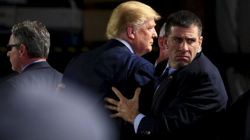Secret Service agents surround Trump as he speaks at Dayton International Airport in Dayton, Ohio, on March 12, 2016. A man <a href="index.php?page=&url=http%3A%2F%2Fwww.cnn.com%2F2016%2F03%2F13%2Fpolitics%2Fthomas-dimassimo-donald-trump-protester-interview%2F" target="_blank">had tried to rush the stage.</a>