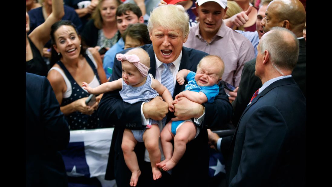 Trump holds two babies during a campaign rally in Colorado Springs, Colorado, on July 29, 2016.