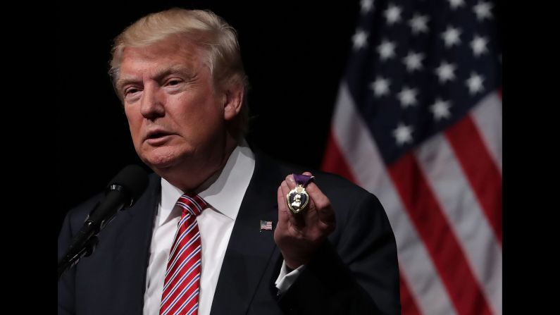 Trump holds a Purple Heart medal <a href="index.php?page=&url=http%3A%2F%2Fwww.cnn.com%2F2016%2F08%2F02%2Fpolitics%2Fdonald-trump-purple-heart%2Findex.html" target="_blank">that a veteran gave to him</a> during a campaign event in Ashburn, Virginia, on August 2, 2016.