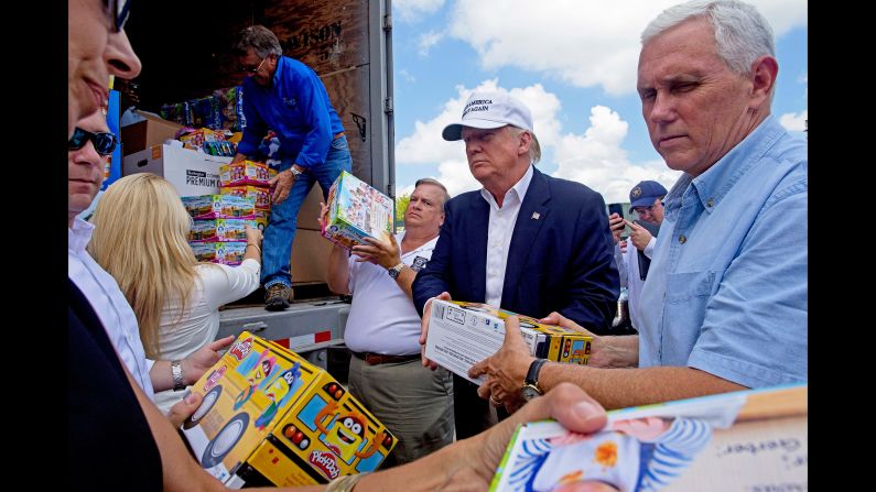Trump and Pence help unload supplies for flood victims during a visit to Gonzales, Louisiana, on August 19, 2016. The two were in the state following <a href="index.php?page=&url=http%3A%2F%2Fwww.cnn.com%2F2016%2F08%2F21%2Fpolitics%2Flouisiana-governor-donald-trump-visit-helpful%2Findex.html" target="_blank">massive flooding</a> in and around Baton Rouge.