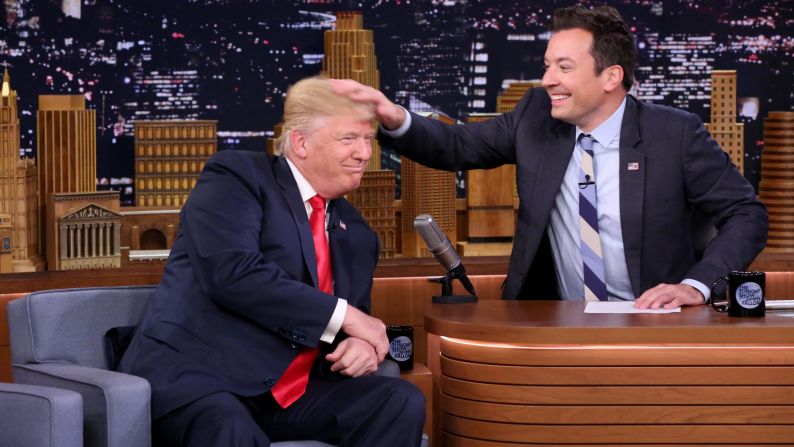 Talk-show host Jimmy Fallon <a href="index.php?page=&url=http%3A%2F%2Fwww.cnn.com%2F2016%2F09%2F15%2Fpolitics%2Fdonald-trump-jimmy-fallon-tonight-show%2F" target="_blank">musses Trump's hair</a> during an episode of "The Tonight Show" in New York on September 15, 2016.