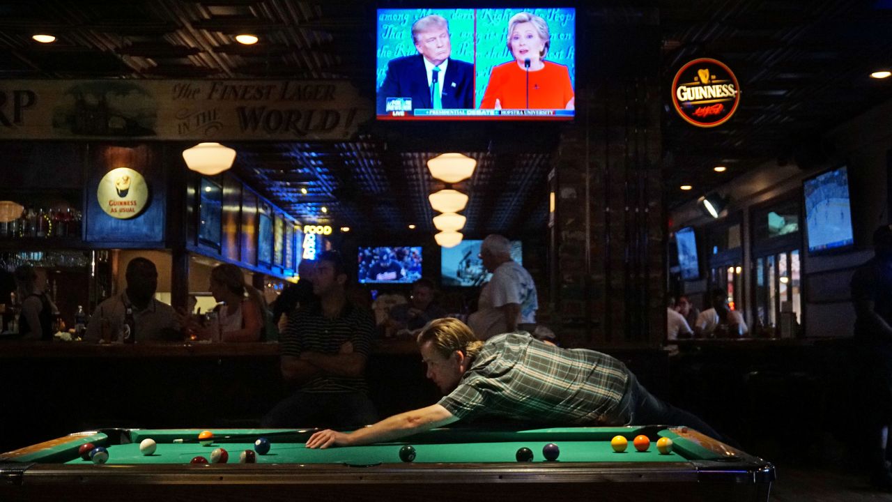 The <a href="http://www.cnn.com/2016/09/26/politics/gallery/first-presidential-debate/index.html" target="_blank">first debate between Trump and Clinton</a> is seen on television at a bar in San Diego on September 26, 2016.