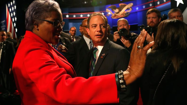 Donna Brazile, acting chairwoman of the Democratic National Committee, talks with Reince Priebus, chairman of the Republican National Committee, before the vice presidential debate. Brazile <a href="index.php?page=&url=http%3A%2F%2Fmoney.cnn.com%2F2016%2F10%2F31%2Fmedia%2Fdonna-brazile-cnn-resignation%2Findex.html" target="_blank">later resigned from her role as a CNN contributor </a>amid fresh revelations that she sent questions to Clinton's campaign in advance of a CNN debate and a CNN-TV One town hall. In a statement, CNN said it was "completely uncomfortable with what we have learned about her interactions with the Clinton campaign while she was a CNN contributor." CNN said it "never gave Brazile access to any questions, prep material, attendee list, background information or meetings in advance of a town hall or debate."