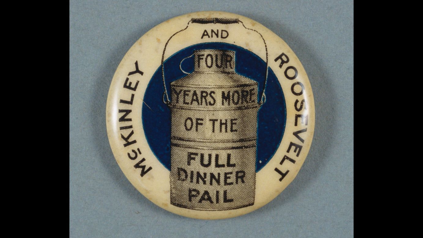 A campaign button carries the Republican campaign slogan of 1900: "Four Years More of the Full Dinner Pail." The slogan refers to the prosperity that the country enjoyed during William McKinley's first term. McKinley and his running mate, Theodore Roosevelt, won re-election over William Jennings Bryan.