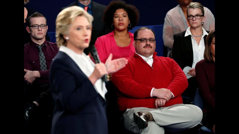 Undecided voter Ken Bone, in the red sweater, listens to Clinton during the second debate. Bone <a href="index.php?page=&url=http%3A%2F%2Fwww.cnn.com%2F2016%2F10%2F10%2Fpolitics%2Fken-bone-reveals-new-details-from-debate%2Findex.html" target="_blank">became a viral sensation</a> after asking his question about the two candidates' energy policies.