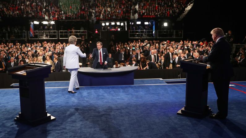 Clinton walks toward moderator Chris Wallace at the end of <a href="index.php?page=&url=http%3A%2F%2Fwww.cnn.com%2F2016%2F10%2F19%2Fpolitics%2Fgallery%2Ffinal-presidential-debate%2Findex.html" target="_blank">the third and final presidential debate</a> on October 19, 2016. There was no handshake between her and Trump.