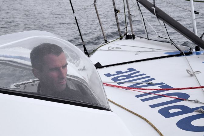 Protected from the elements -- French skipper Armel le Cleac'h on Banque Populaire off the Port-la-Foret coast, western France. Not yet 40, he has already been a runner-up twice in the Vendee Globe.