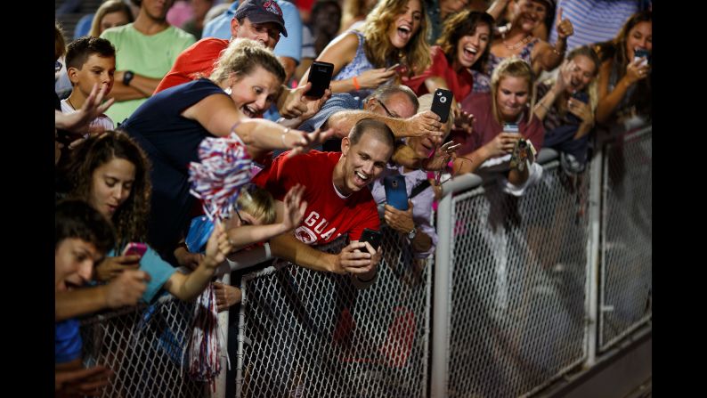 Trump supporters take photos of Trump as he leaves a rally in Mobile, Alabama, on August 21, 2015. The rally <a href="index.php?page=&url=http%3A%2F%2Fwww.cnn.com%2F2015%2F08%2F22%2Fpolitics%2Fgallery%2Ftrump-rally-alabama%2Findex.html" target="_blank">was held in a football stadium</a> to accommodate 30,000 supporters.