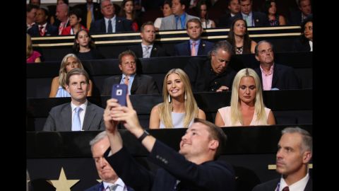 Trump's daughter Ivanka smiles for a man's photo at the convention.