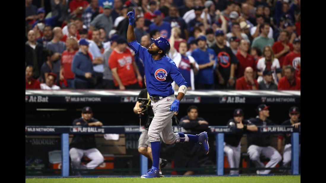 Dexter Fowler of the Cubs celebrates after hitting a lead off home run in the first inning of Game 7.